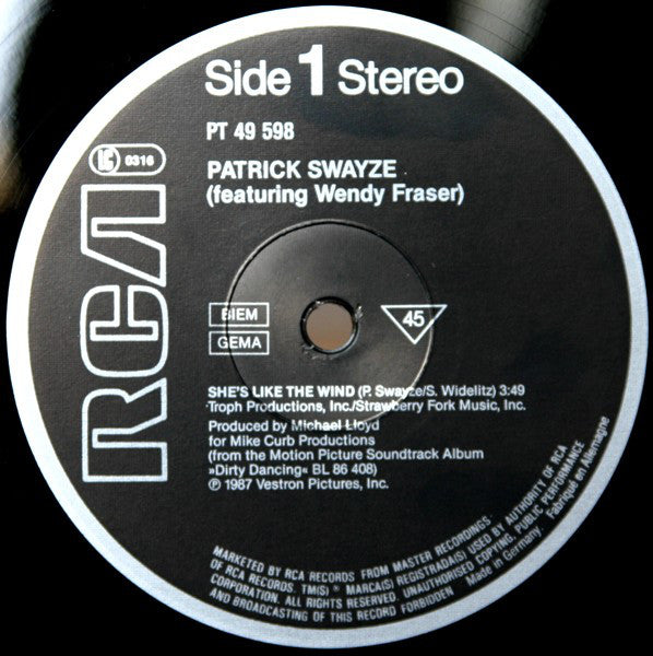 Patrick Swayze Featuring Wendy Fraser / Maurice Williams & The Zodiacs / Merry Clayton : She's Like The Wind (12", Maxi)