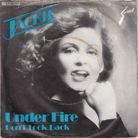 Jackie (7) : Under Fire (7", Single)