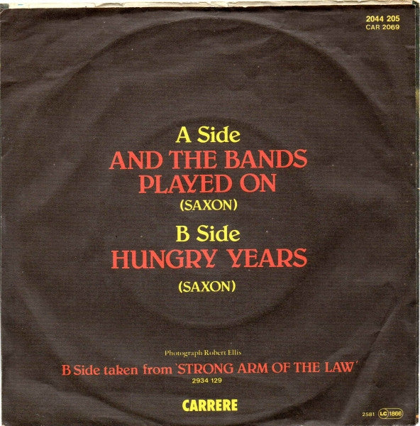 Saxon : And The Bands Played On (7", Single)