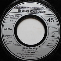 Elton John : Return To Paradise (7", Single)