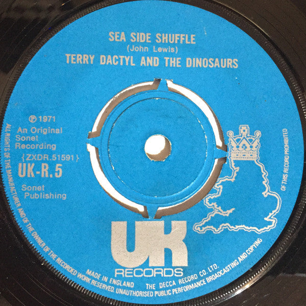 Terry Dactyl And The Dinosaurs : Sea Side Shuffle / Ball And Chain (7", Single, Pus)